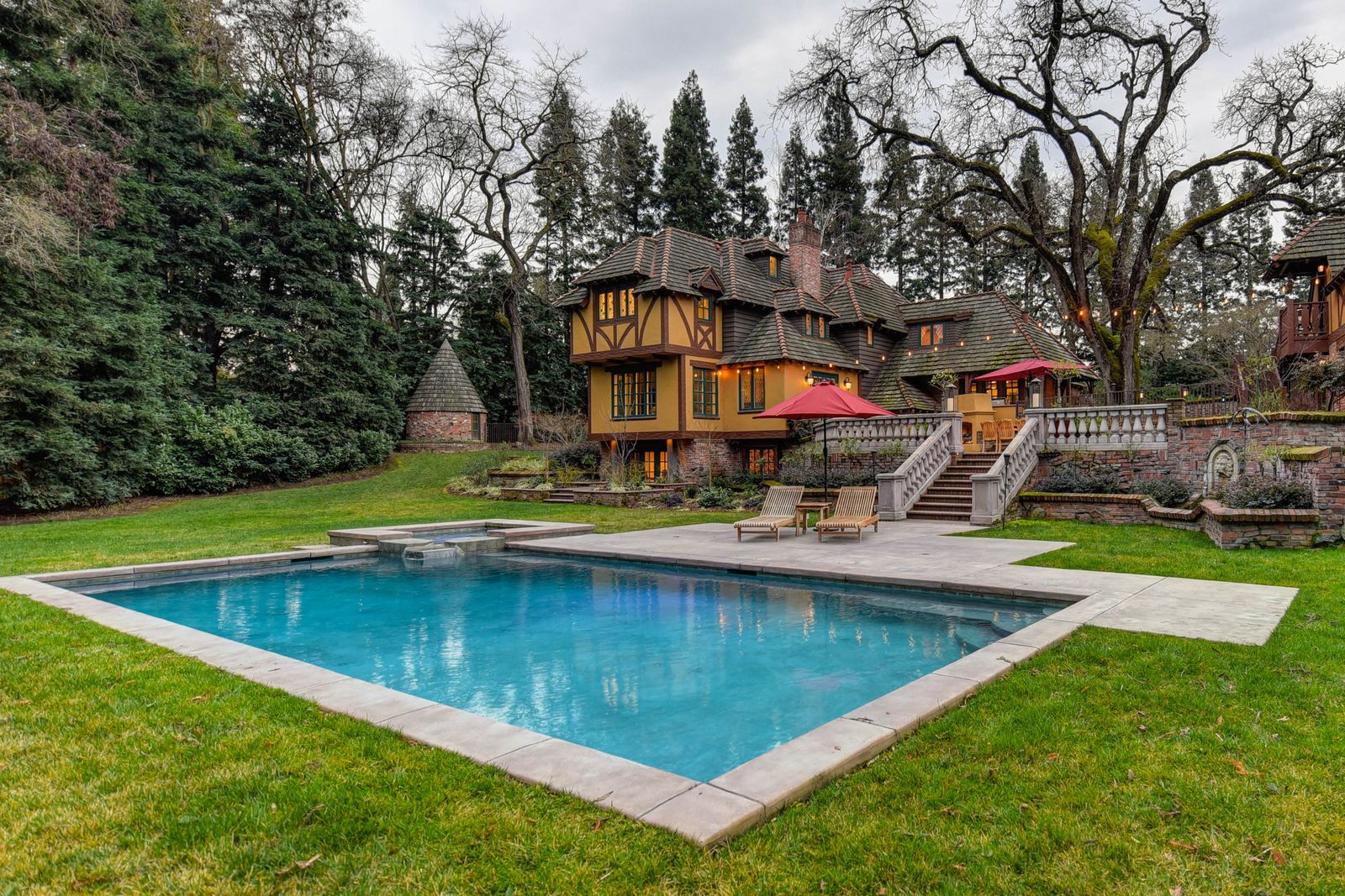 Backyard pool and deck with mature trees in East Tennessee