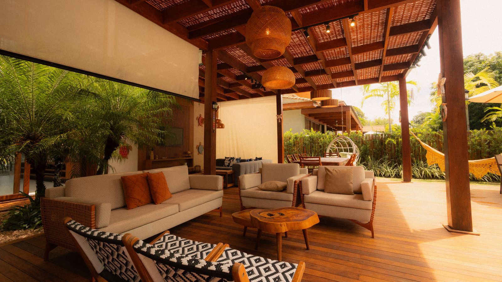 Covered outdoor living room with sofas and pergola